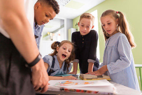 kids looking through their new lesson