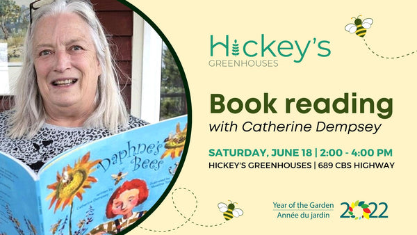 An image of a woman smiling and holding a children's book. The event is on June 18, 2022 from 2-4pm at Hickey's Greenhouses in Kelligrews.