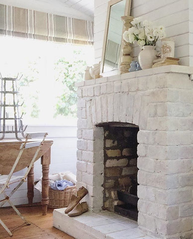 Red Brick Fireplace painted in White Limewash to be white Lime Wash over Red bricks