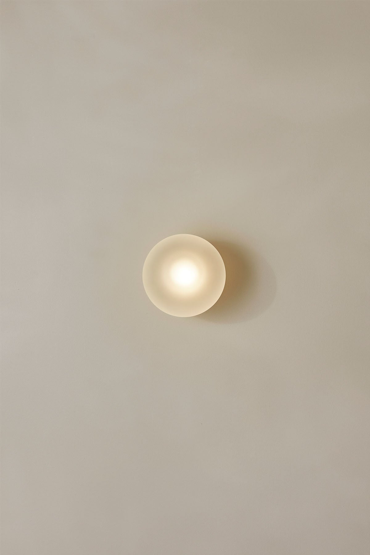 Orb Surface Sconce, Large in Clear Frosted. Image by Lawrence Furzey.