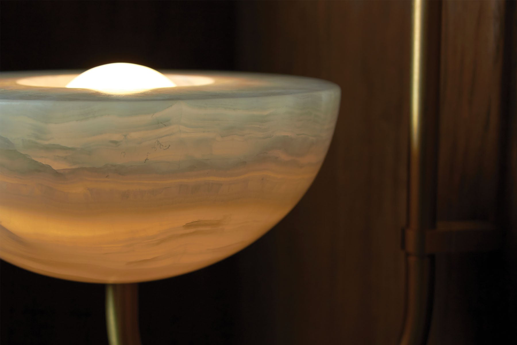 Aurelia Wall Light in White Onyx and Brass. Image by Lawrence Furzey