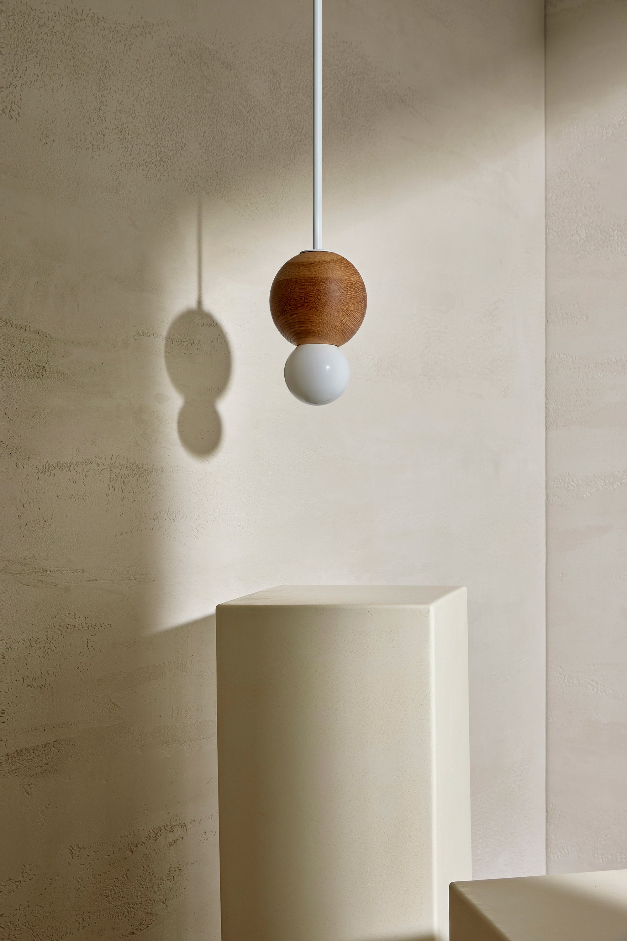 Bright Beads Sphere Pendant in Oak, White Satin & Opal. Photographed by Lawrence Furzey.