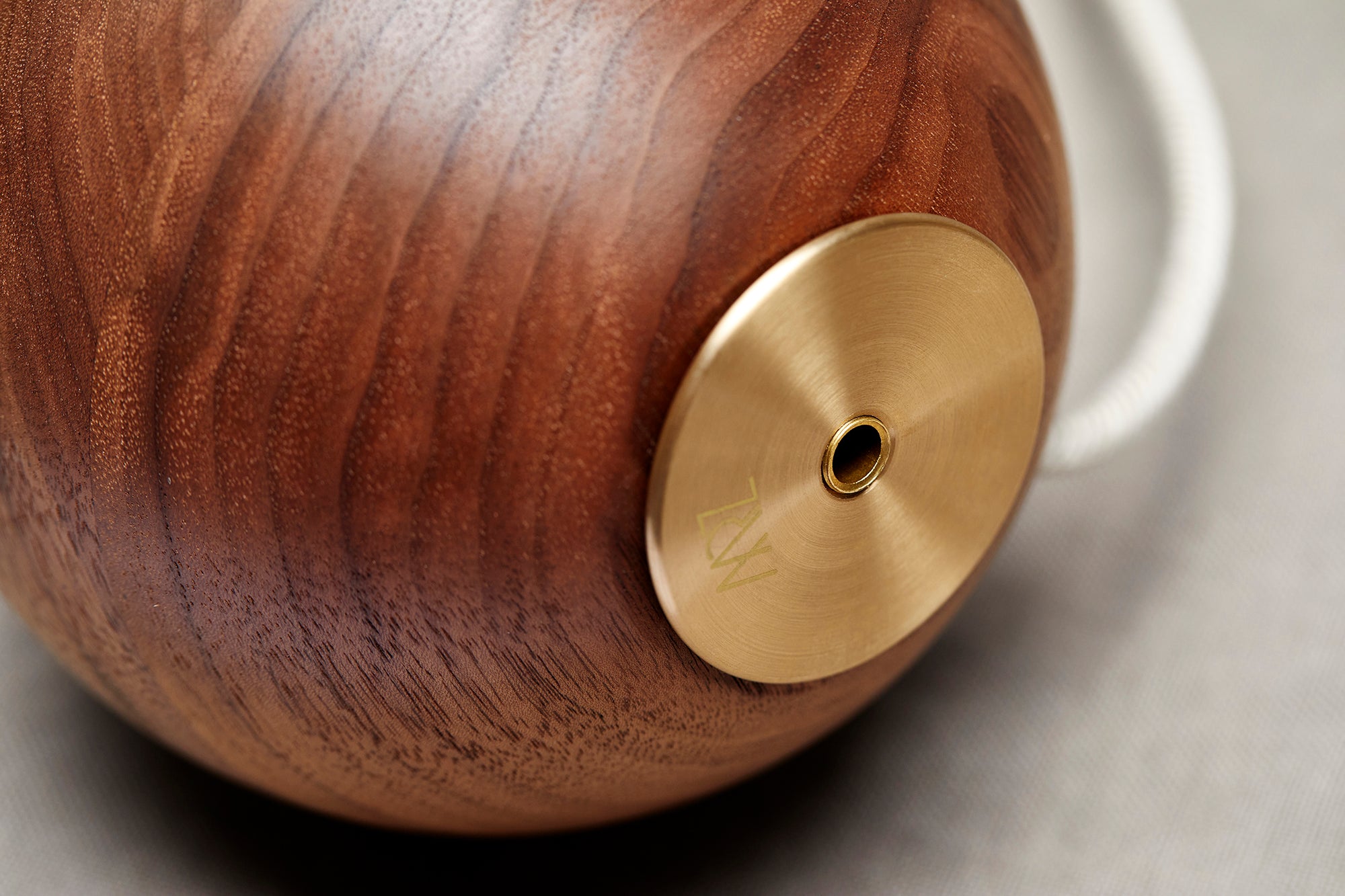 Detail of Bright Beads Sphere Table Light in Walnut & Brass. Photographed by Lawrence Furzey.