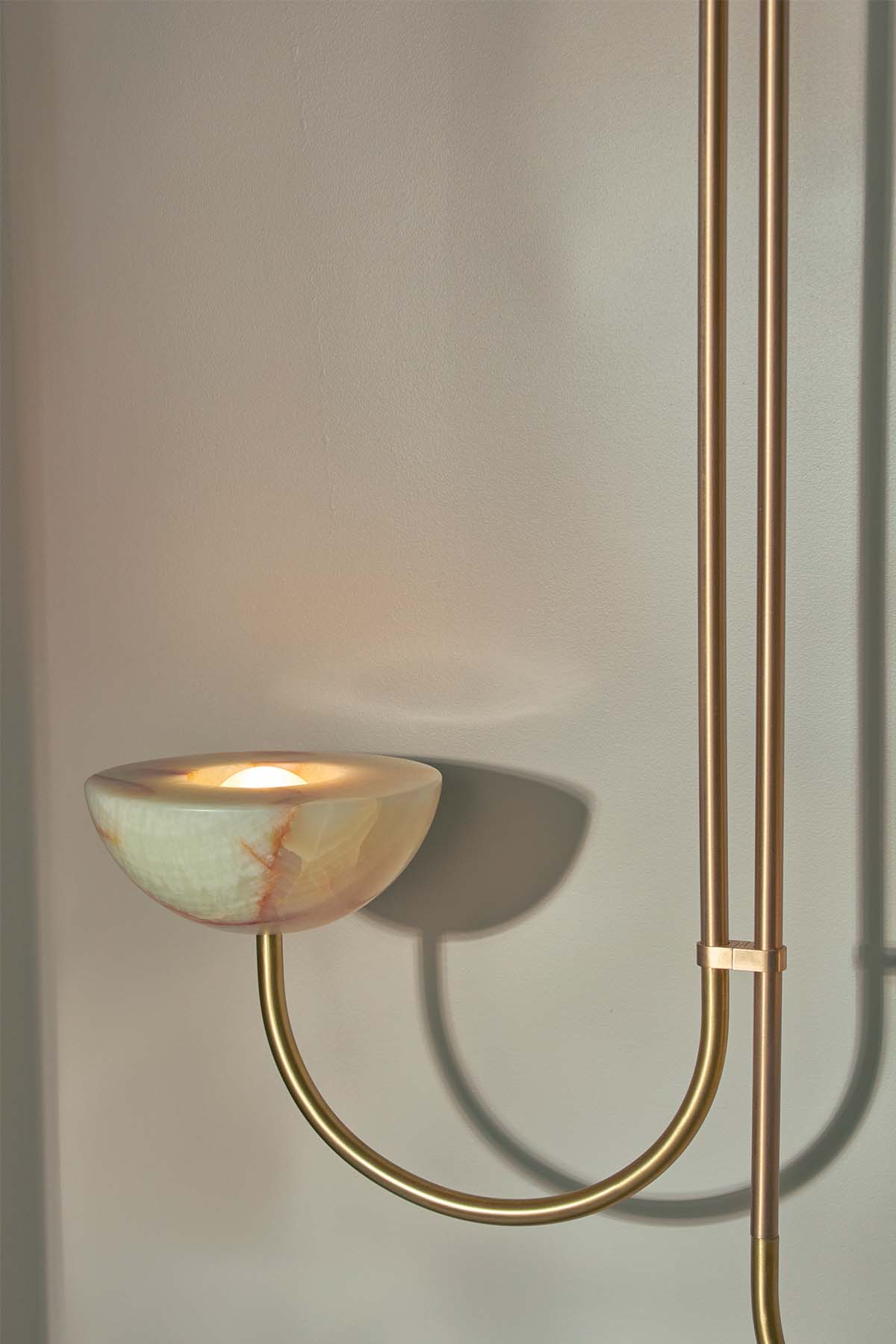 Aurelia Double Offset Pendant, Jade Onyx and Brass. Image by Lawrence Furzey