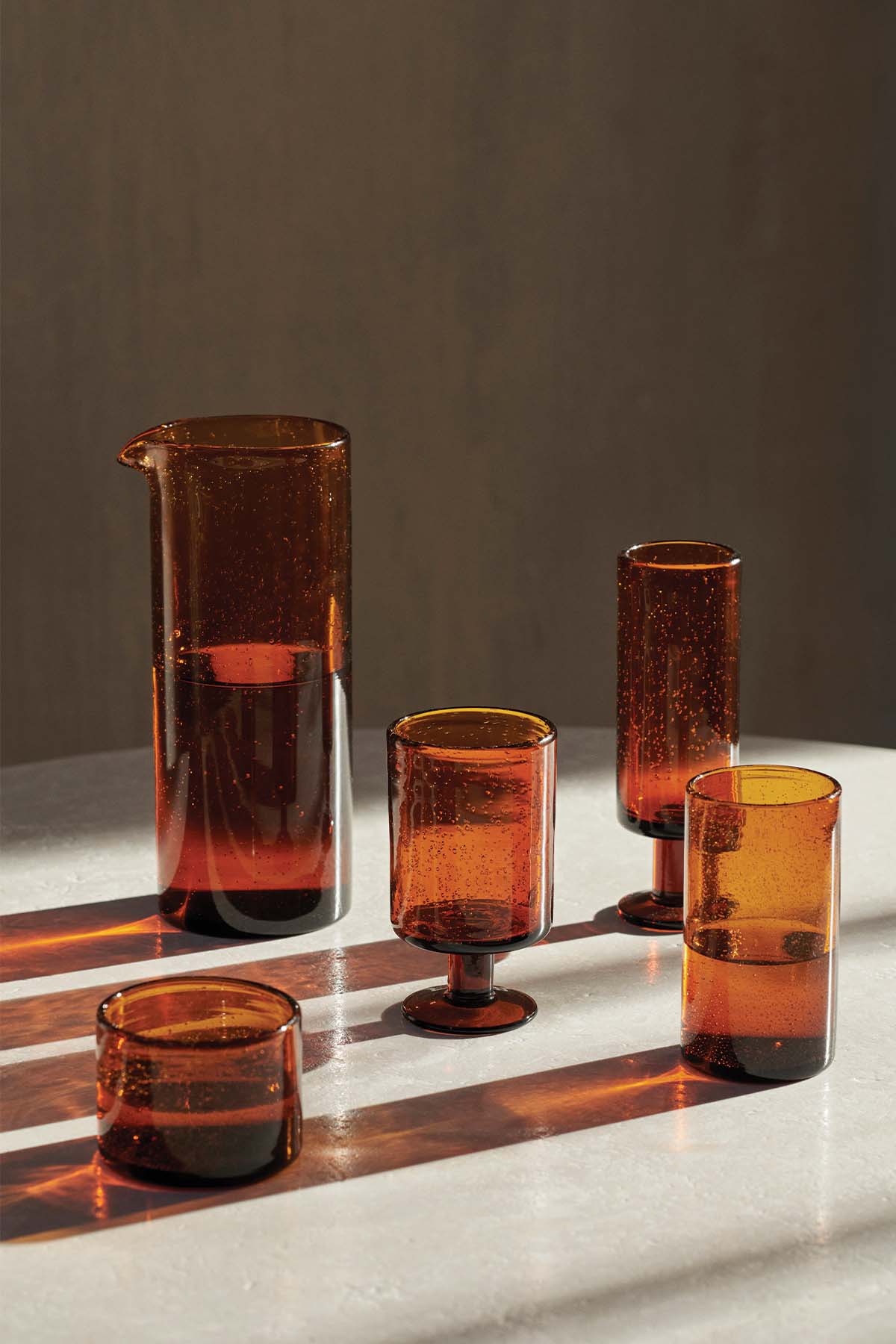 Ferm Living, Oli Glass Collection in Amber. Image provided by Ferm Living.