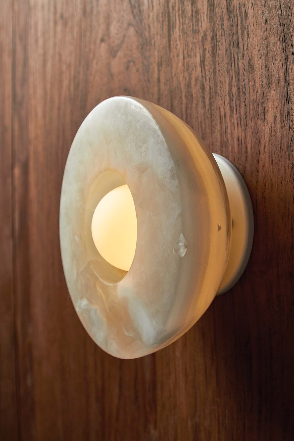 Aurelia Surface Sconce in White Onyx and White Satin. Image by Lawrence Furzey