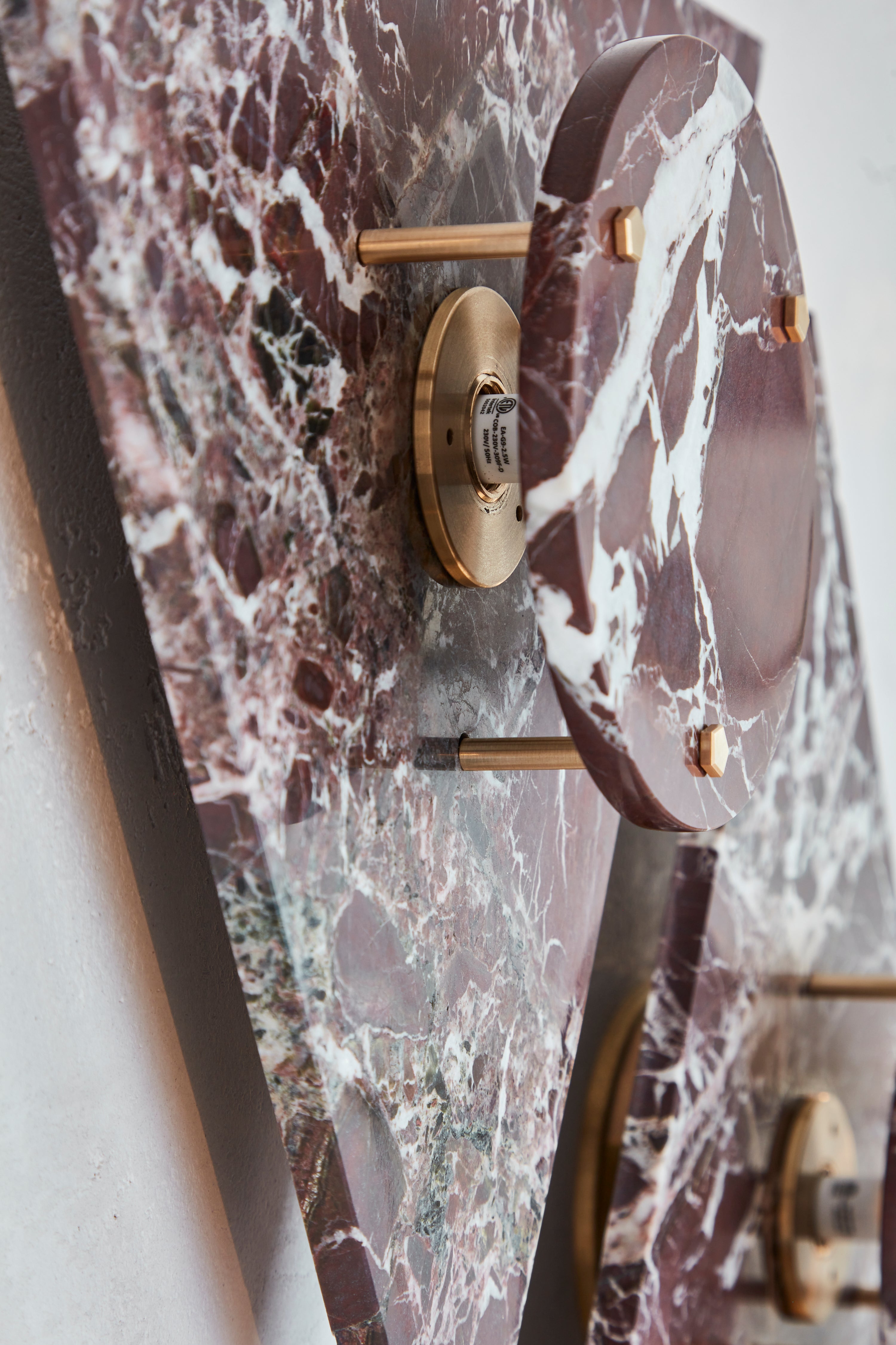 Detail of the Bermuda Wall Light in Plum & Brass.