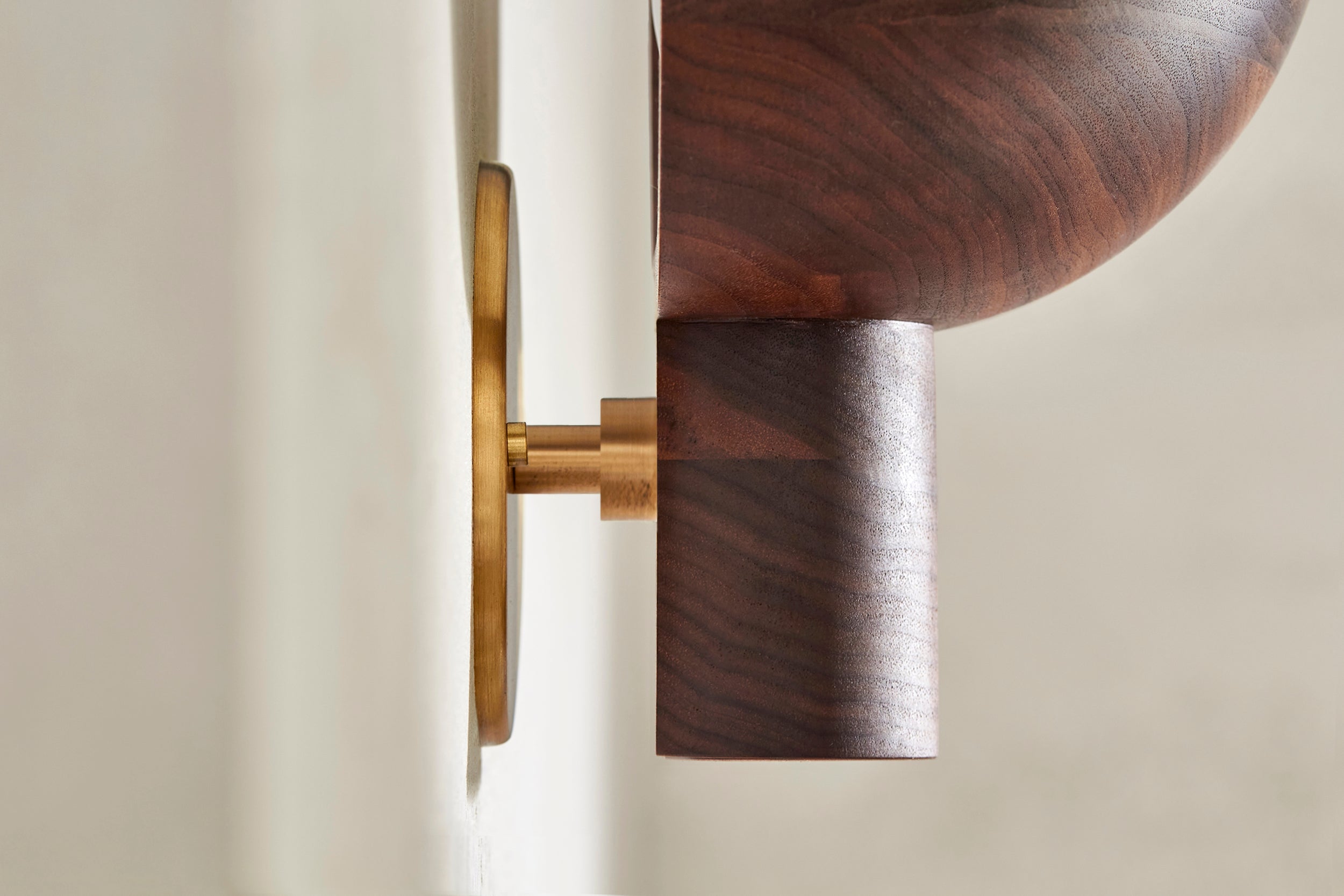 Detail of Selene Uplight, Large in Walnut and Brass. Photographed by Lawrence Furzey.