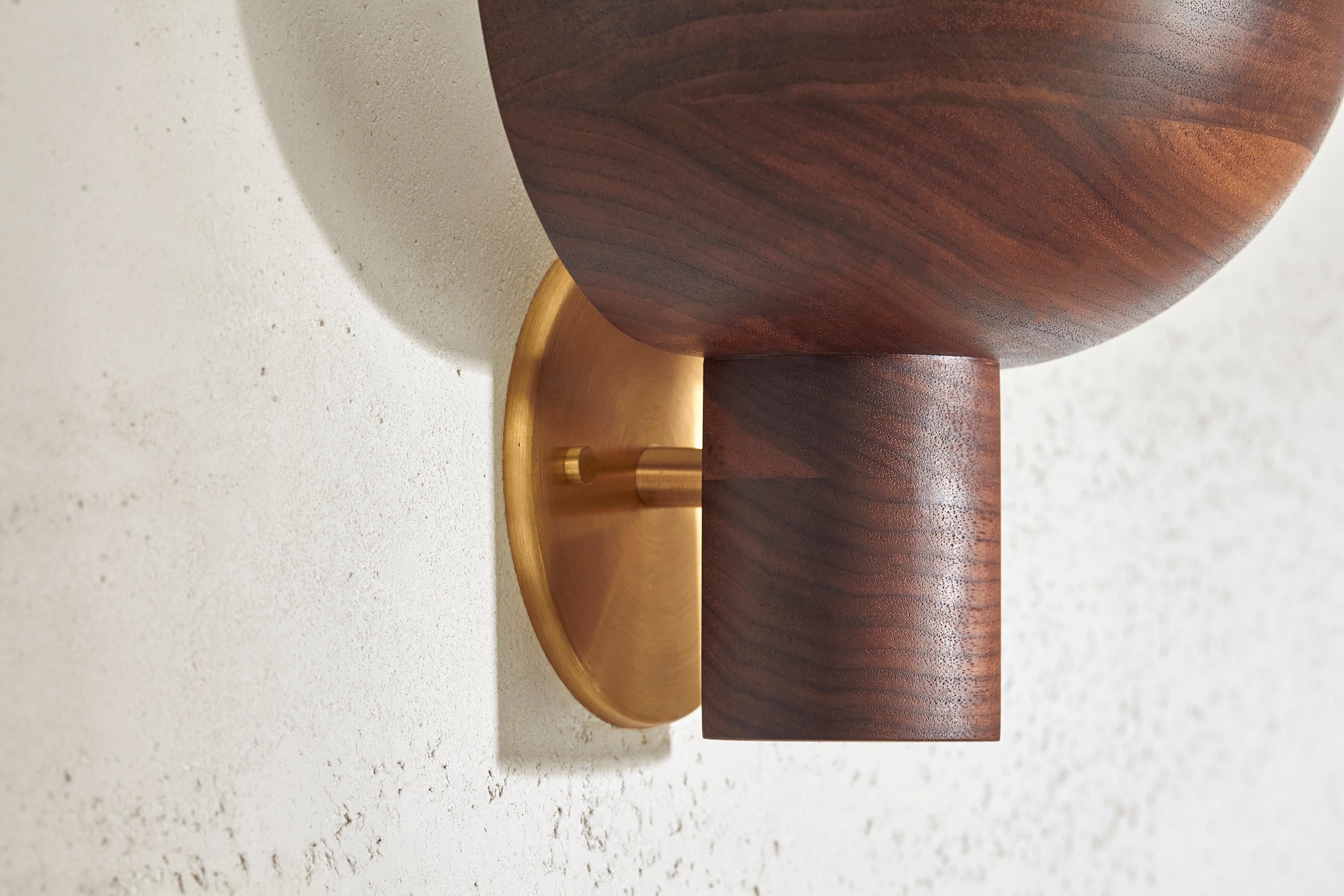 Detail of Selene Uplight, Large in Walnut and Brass. Photographed by Lawrence Furzey.