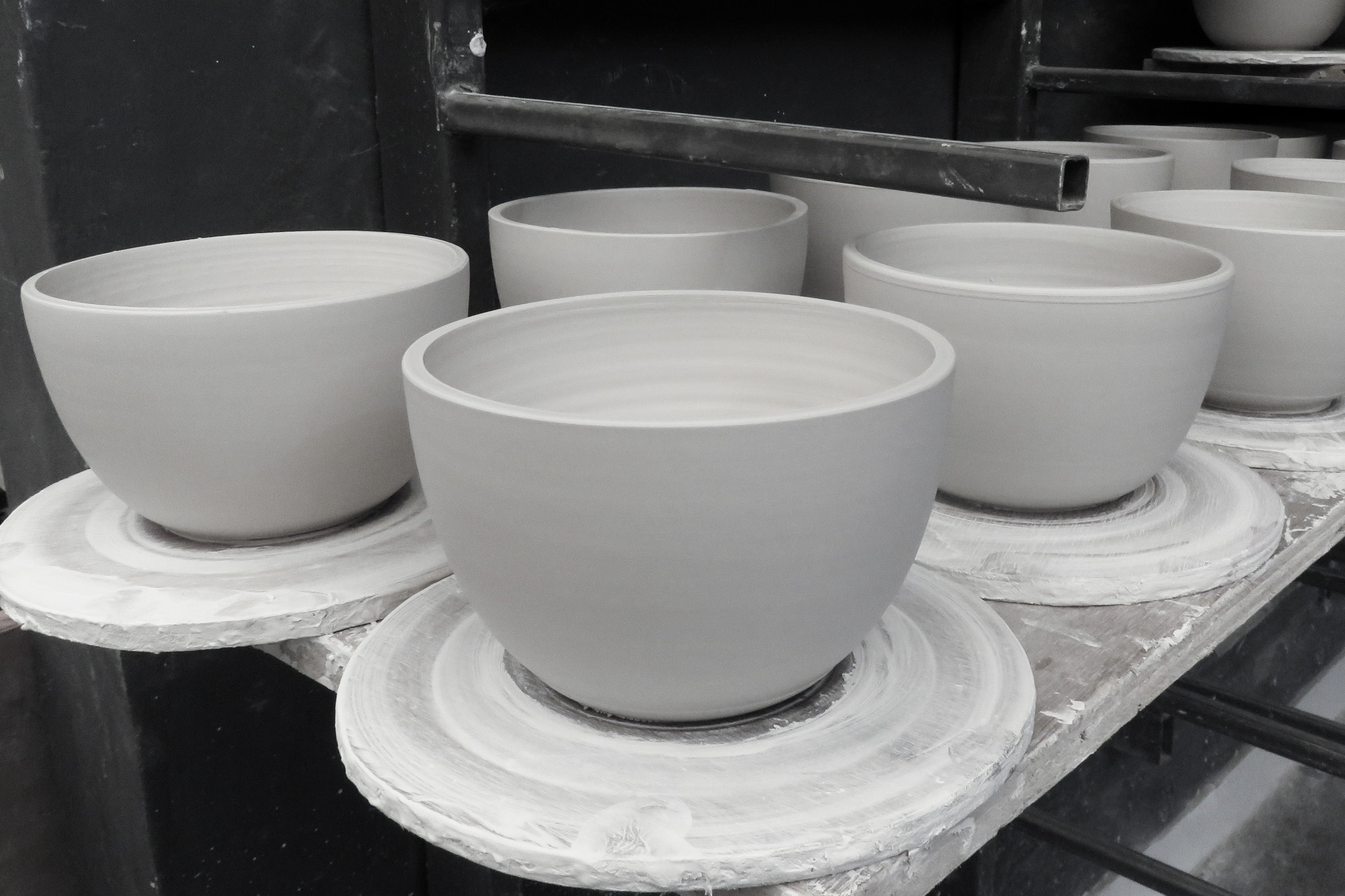 Our handmade clay ceramic shades in various stages of production. Photo supplied by Gaya ceramics