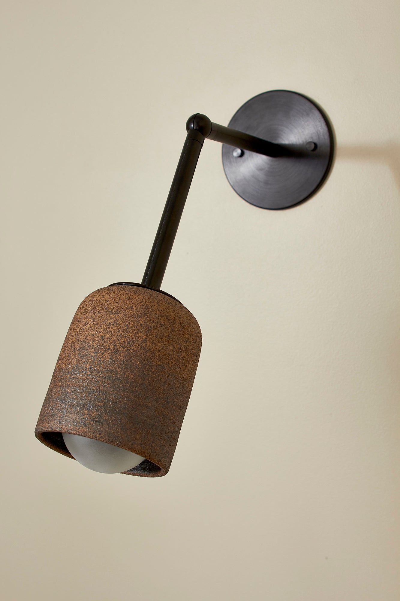 Terra 1 Long Wall Light in Clay & Brushed Black. Photographed by Lawrence Furzey.