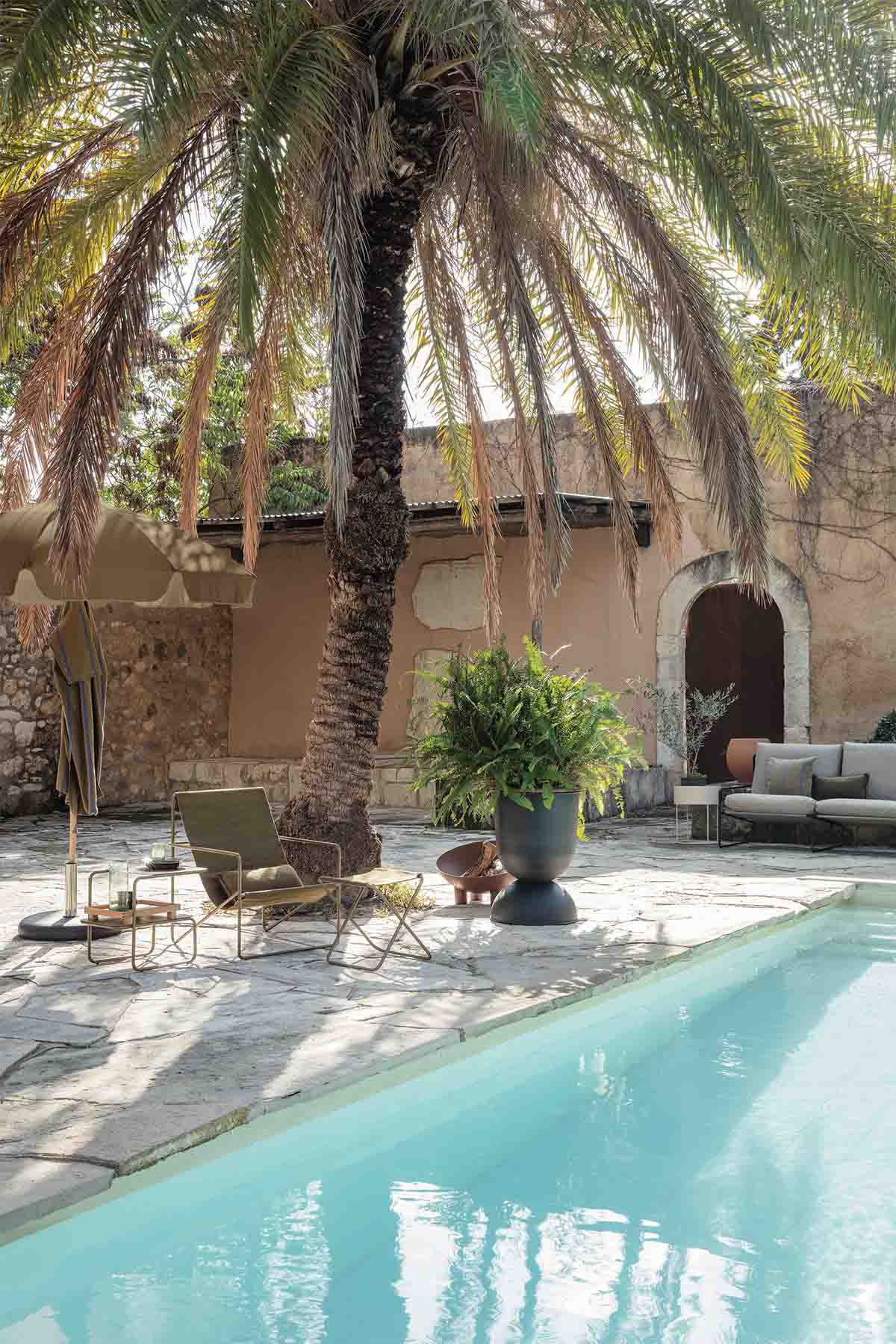 Lull Umbrella in-situ with Desert Lounge Chair. Image by Ferm Living.