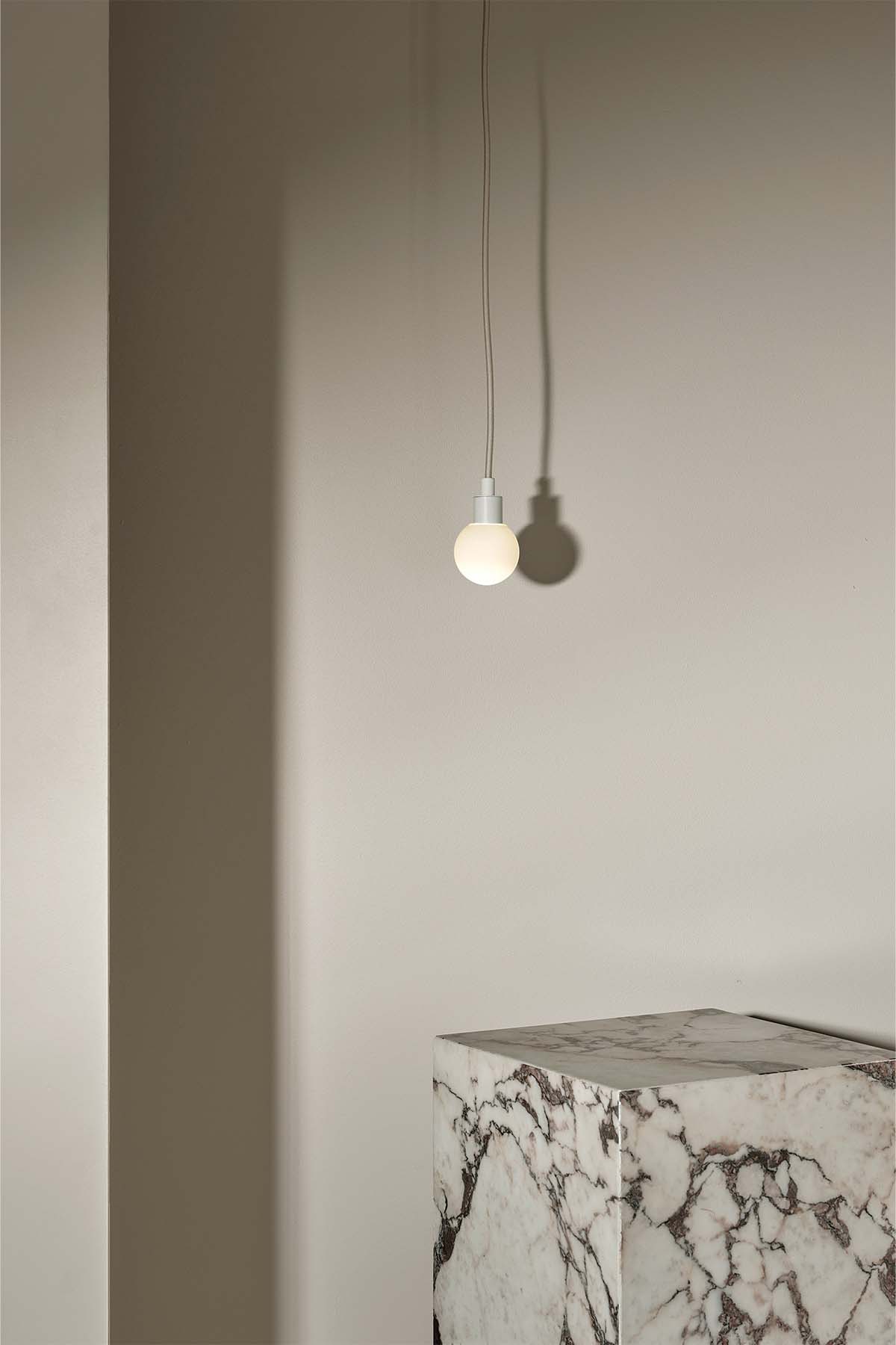 Orb Pendant, Mini in White Satin and White Frosted. Image by Lawrence Furzey