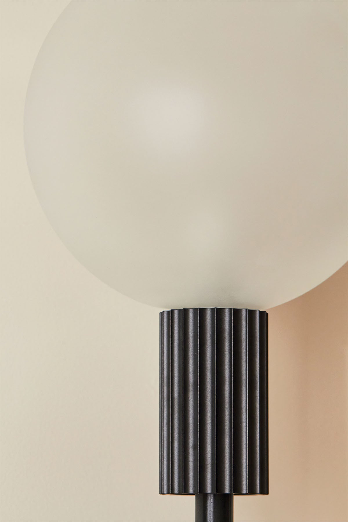 Attalos Wall Light, 200 in Brushed Black. Image by Lawrence Furzey. 