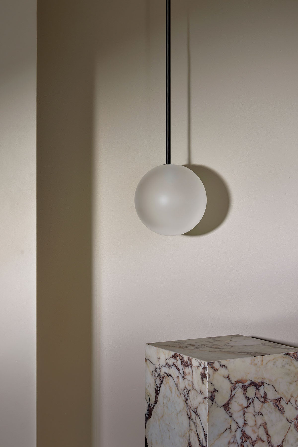 Orb Pendant, Large in Brushed Black and Clear Frosted. Image by Lawrence Furzey