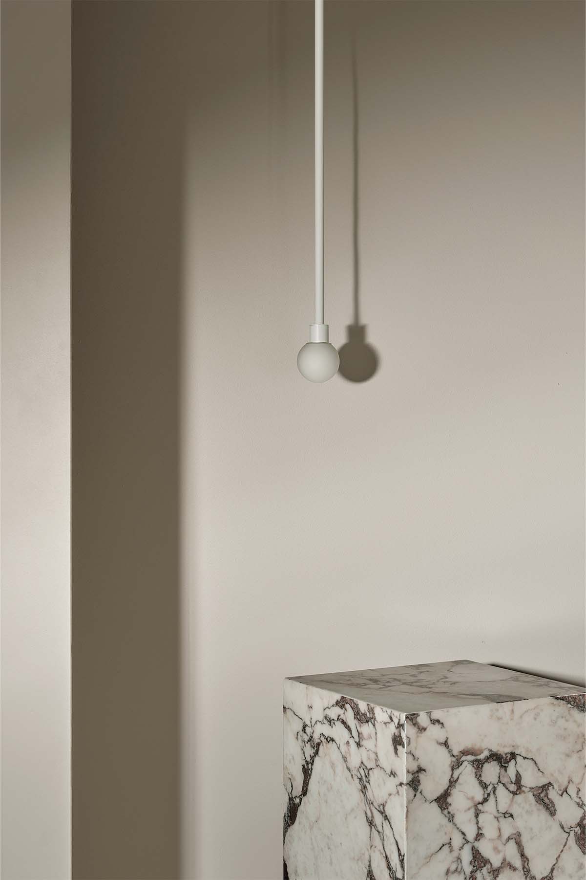 Orb Pendant, Mini in White Satin and White Frosted. Image by Lawrence Furzey