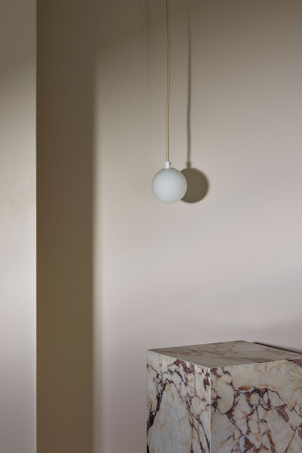 Orb Small Pendant, Solid Rod in White Satin and White Frosted. Image by Lawrence Furzey