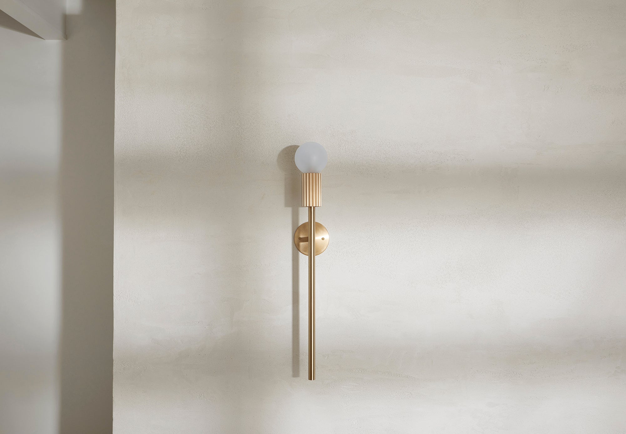 Marz Designs Attalos Wall Light 95 hanging on a wall.