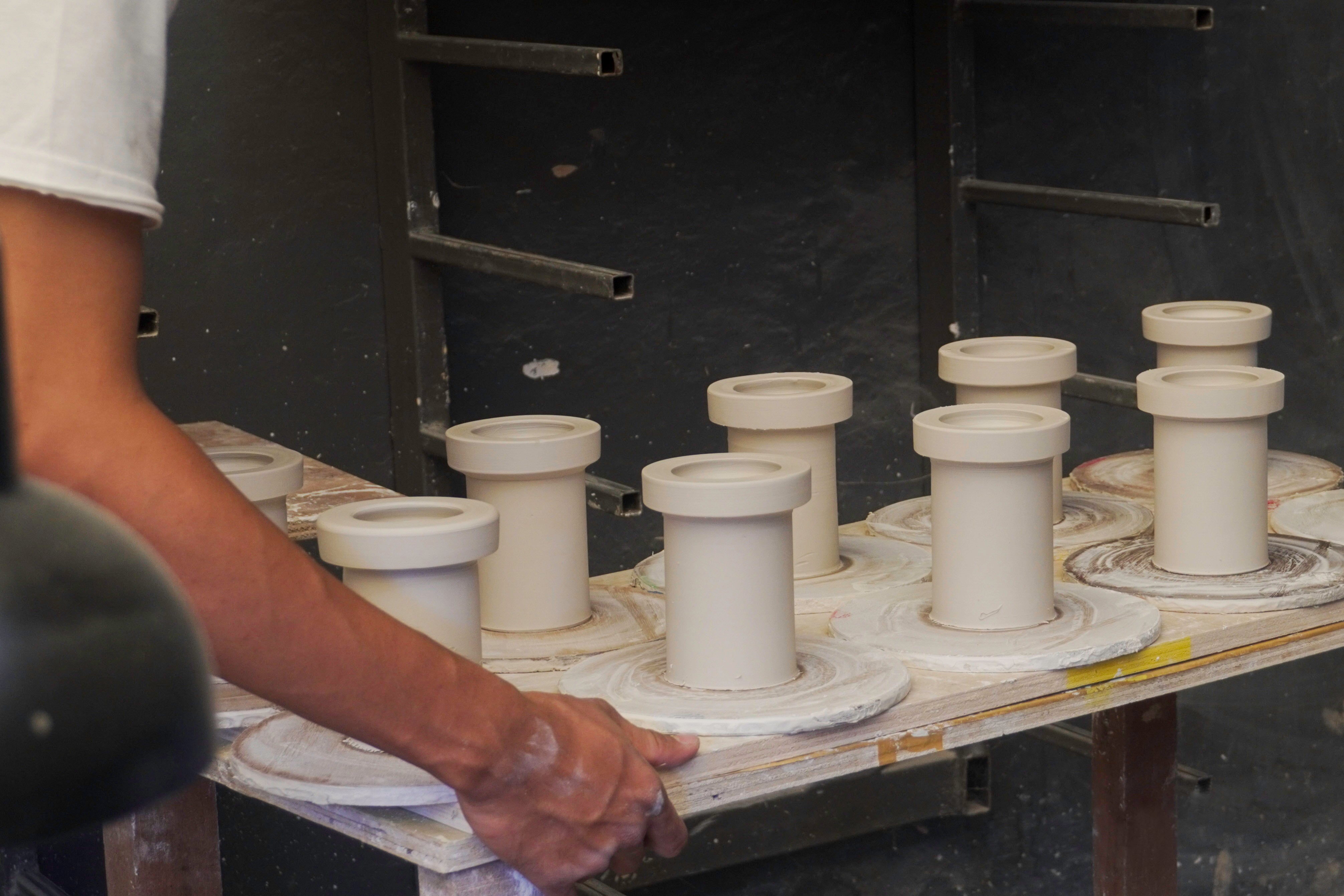 Our handmade clay ceramic shades in various stages of production. Photo supplied by Gaya ceramics.