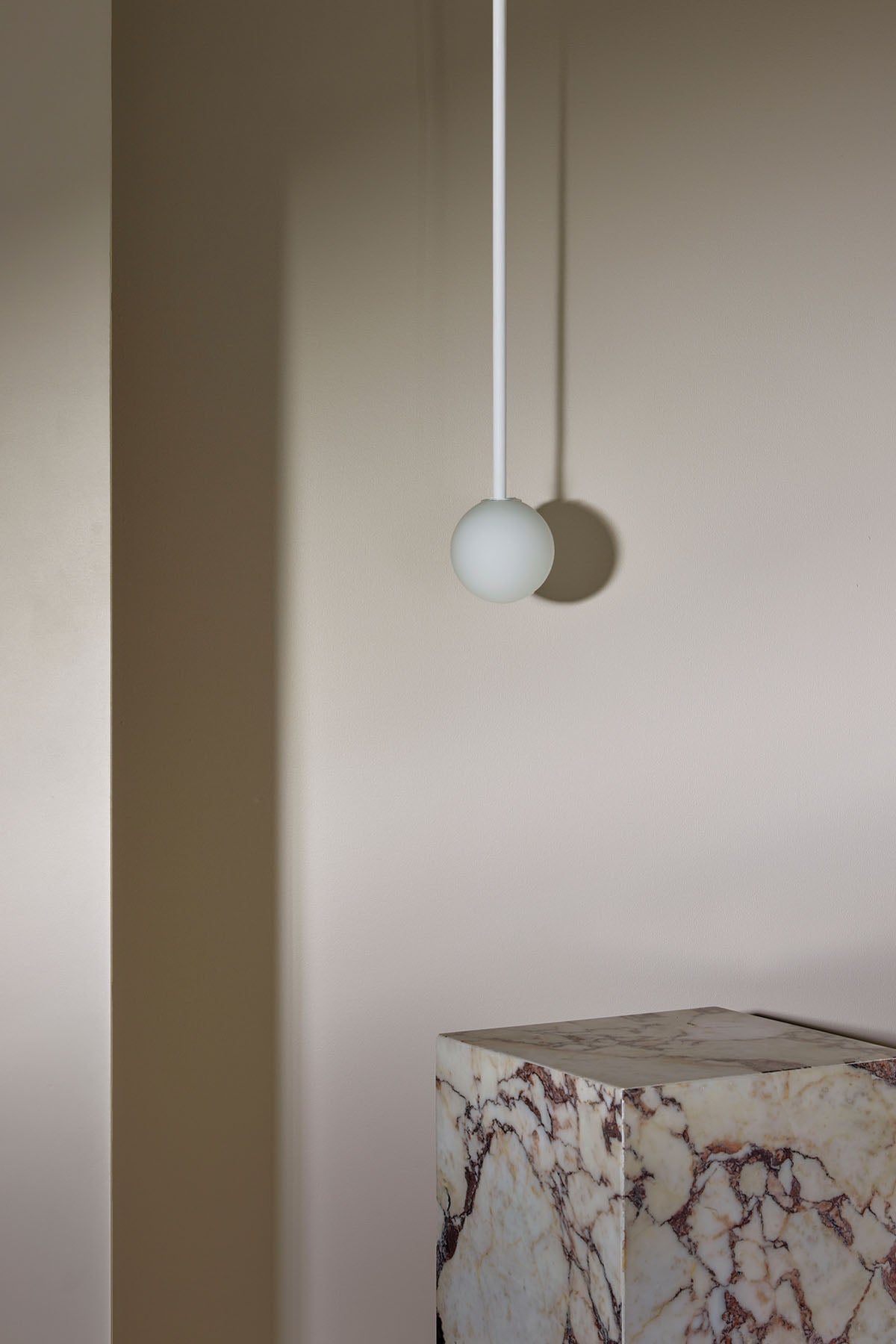 Orb Small Pendant, Solid Rod in White Satin and White Frosted. Image by Lawrence Furzey