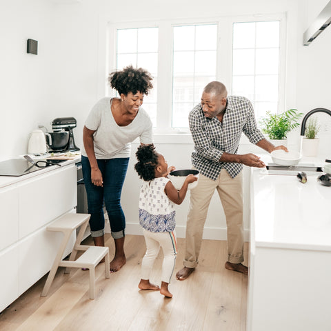 Family cleaning the kitchen together