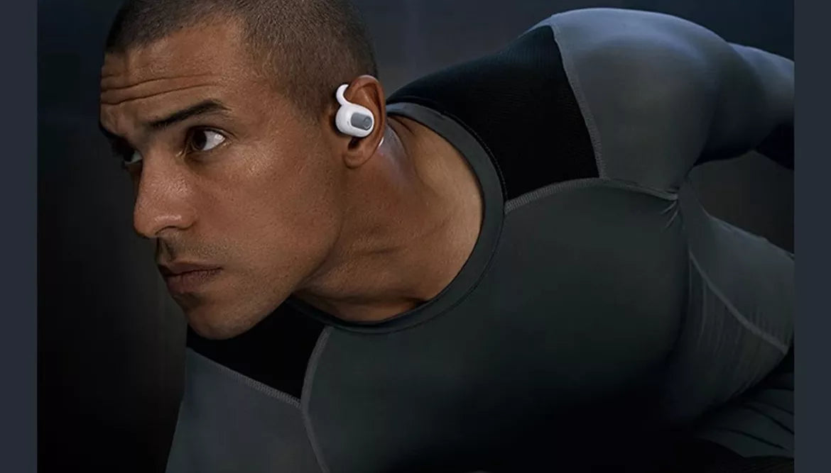 A man wear air conduction headphones
