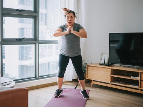 Total Body Conditioning Class image of woman stretching from workout worthy near syracuse ny