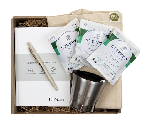 Image of a sustainable giftbox that includes coffee bags, a notebook, pen, and more