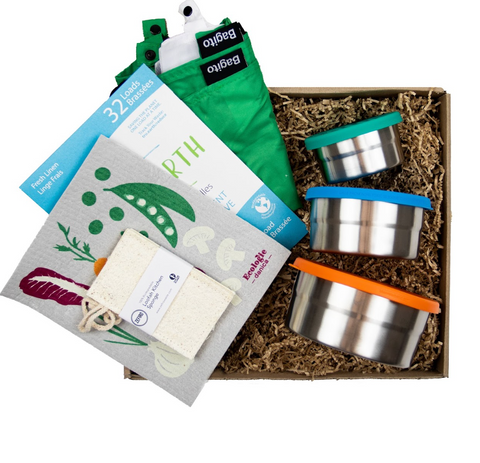 Image of a sustainable gift box that includes swedish dishcloths, to-go cups from To-Go Ware, and produce bags from Bagito