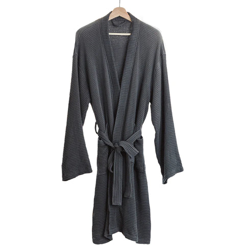 Image of a dark grey bathrobe hanging from a hanger. 