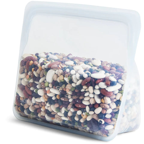 Image of a silicone Stasher stand up bag filled with different colored beans