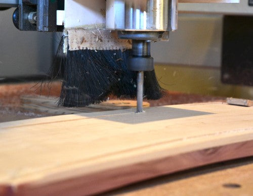 Endmill cutting through wood