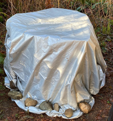 GeoBin layered composter covered with a tarp