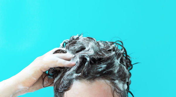 woman washing hair extensions