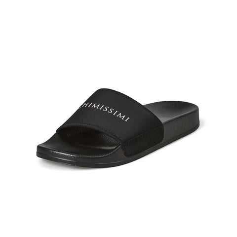 Designer black slides with velcro on the side.