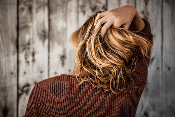 A person receiving a specialized hair regrowth treatment