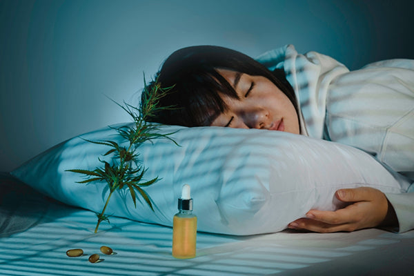 Image featured in the 'Uncovering the CBN Effects: Benefits, Side Effects & More' post by MDBiowellness - Plant Medicine, developed by doctors. Depicts a person sleeping peacefully with a CBN tincture in the background, highlighting CBN effects.