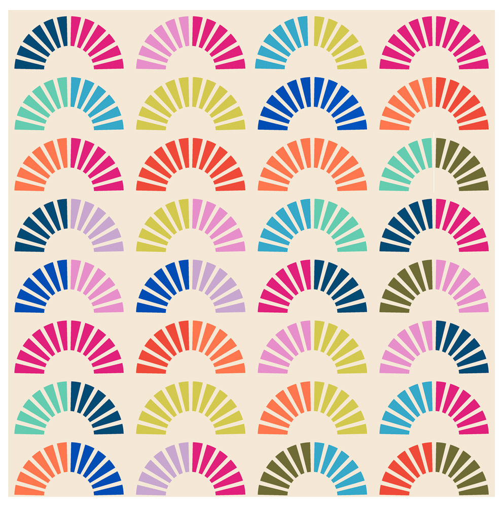 A colorful quilt made of quarter circle wedges on a cream background