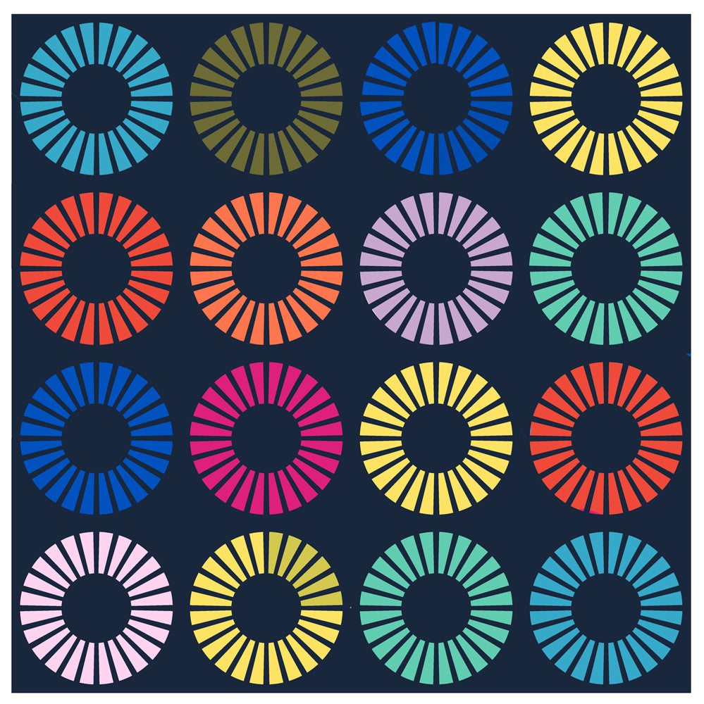 A colorful quilt made of quarter circle wedges on dark navy background.