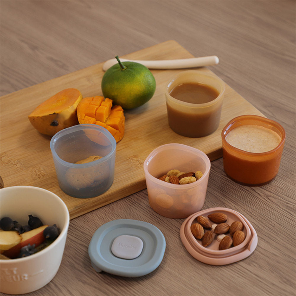 Moonkie food storage containers with various healthy foods in them