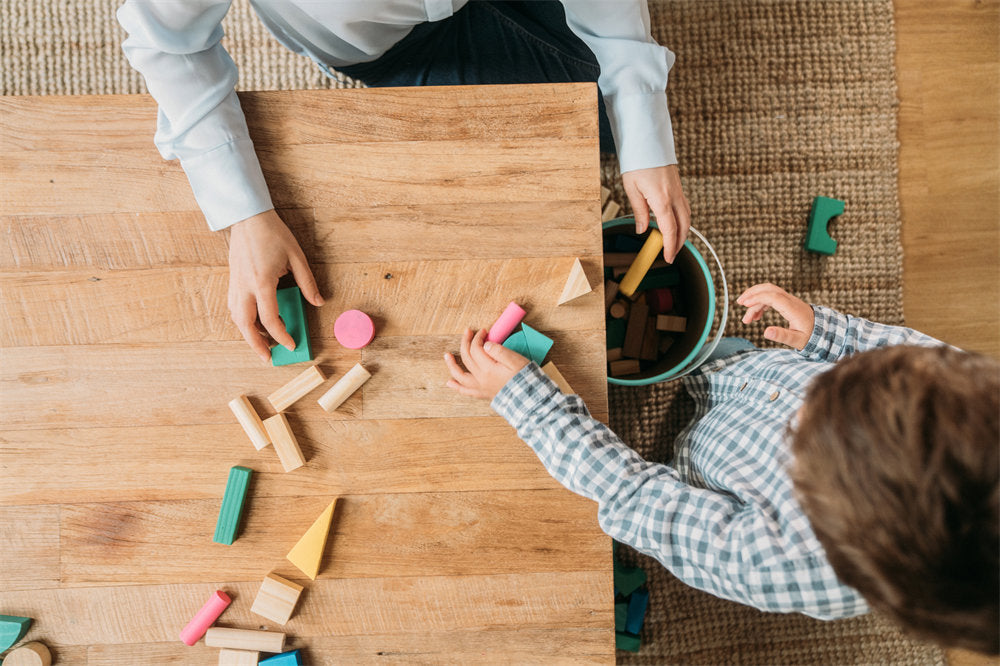 Family playing with building blocks