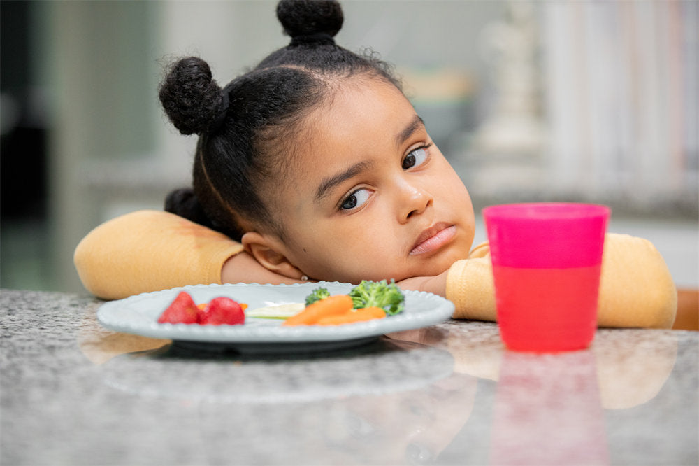 Upset toddler refuses to eat healthy meal because she is a picky eater