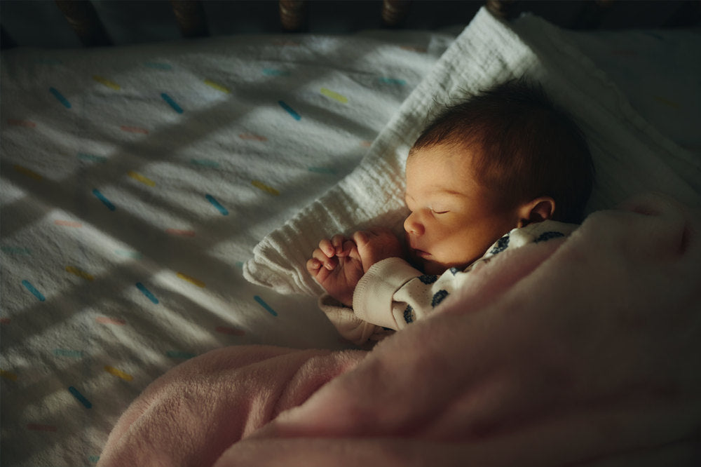 Sleeping newborn baby girl