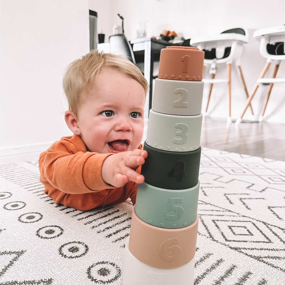 Baby playing Moonkie silicone stacking cup