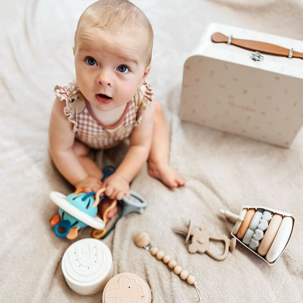 Baby playing Moonkie playtime gift set