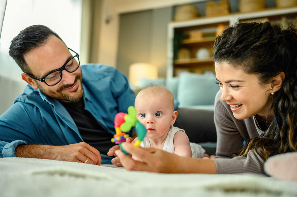 parents playing with baby