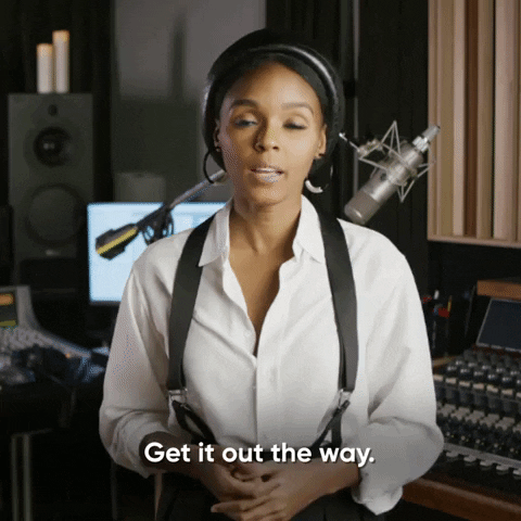 A professional woman in a recording studio matter-of-factly saying "get it out the way."
