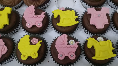 baby shower pink and yellow cupcakes