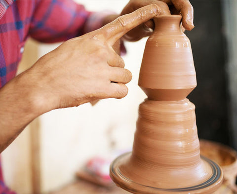 A Vase being Spinned on the Pottery Wheel