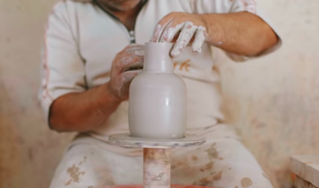 Craftsman Spinning a Vase on the Pottery Wheel